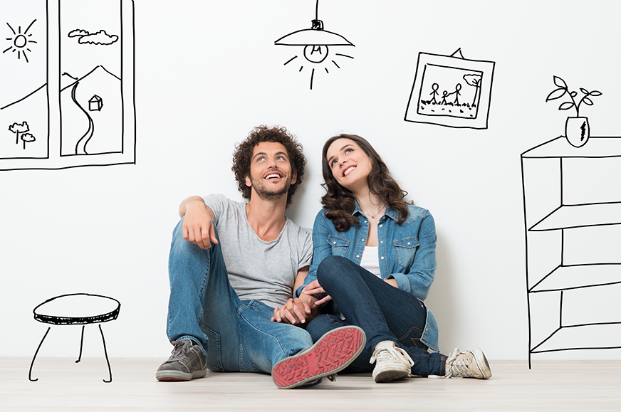a couple sits on the floor and looks up with illustrations drawn around them on the walls