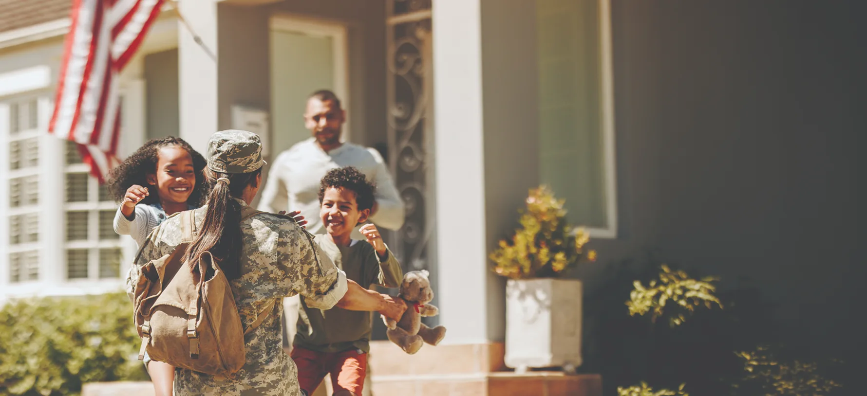 servicewoman embracing her children on her homecoming