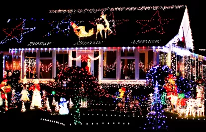 a house decked out in christmas lights at night