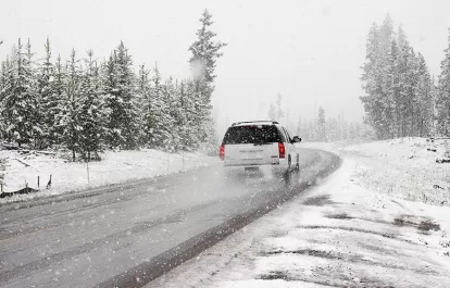 a car driving in the snow