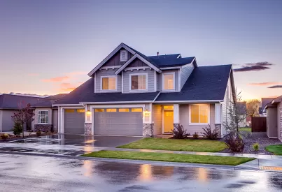 the front of a two-story home outside at dusk